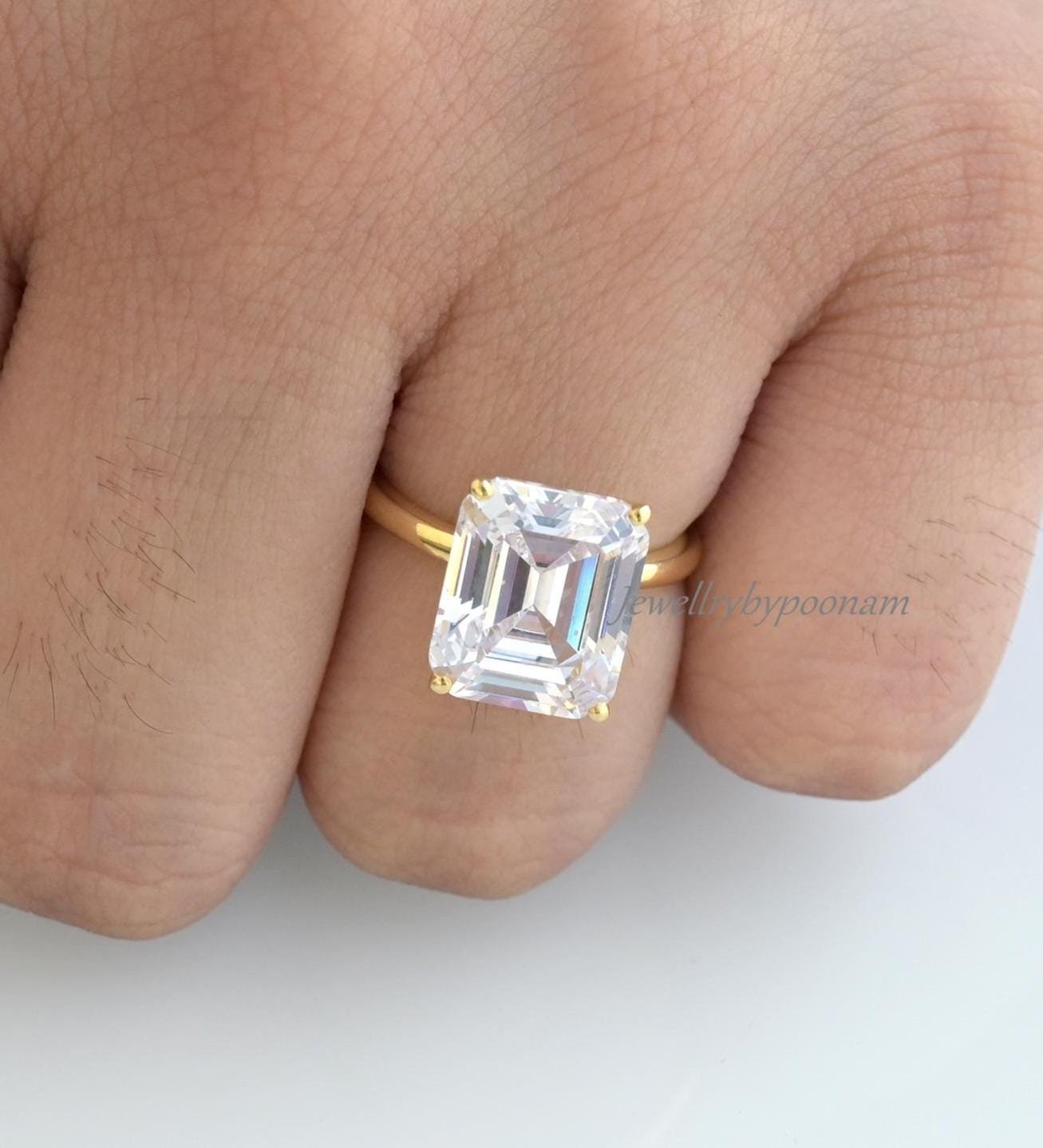 Emerald Cut Solitaire Ring: 3.5 CT Moissanite, Yellow Gold - Jewelry By Poonam | SKU: PJR2762-SLNSMN-US-5 2/26 Emerald Cut Solitaire Ring: 3.5 CT Moissanite, Yellow Gold - Jewelry By Poonam | SKU: PJR2762-SLNSMN-US-5 2/26